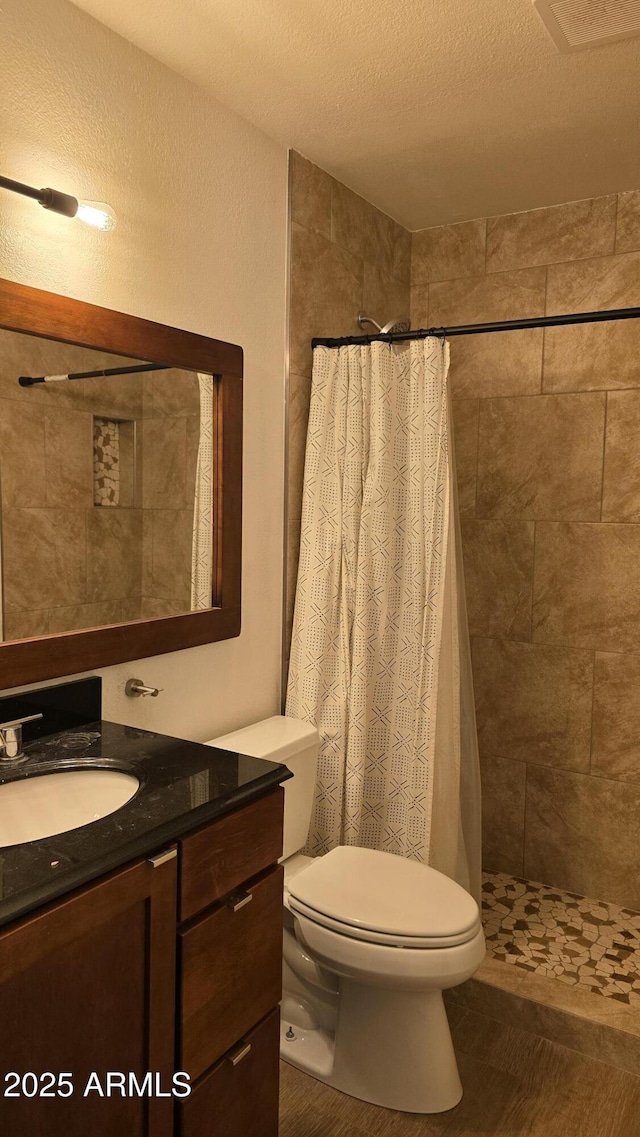 10232 N 86th St, Scottsdale, AZ 85258 - full bath with vanity, a tile shower, and a textured ceiling