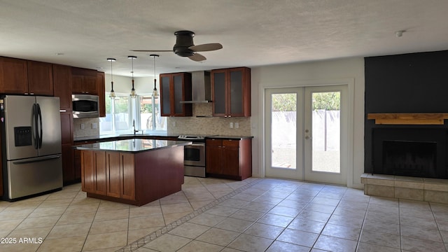 10232 N 86th St, Scottsdale, AZ 85258 - kitchen featuring stainless steel appliances, wall chimney range hood, ceiling fan, light tile patterned flooring, and decorative backsplash