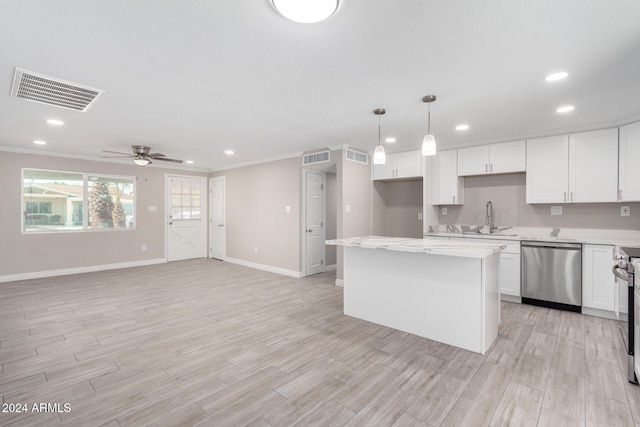 kitchen with ceiling fan, a center island, hanging light fixtures, white cabinets, and appliances with stainless steel finishes