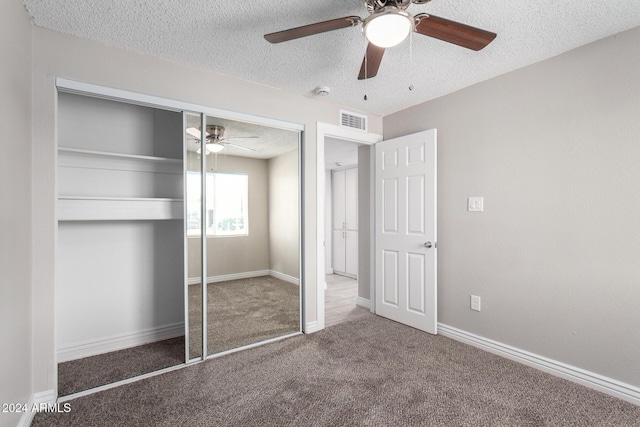 unfurnished bedroom featuring ceiling fan, a textured ceiling, and a closet