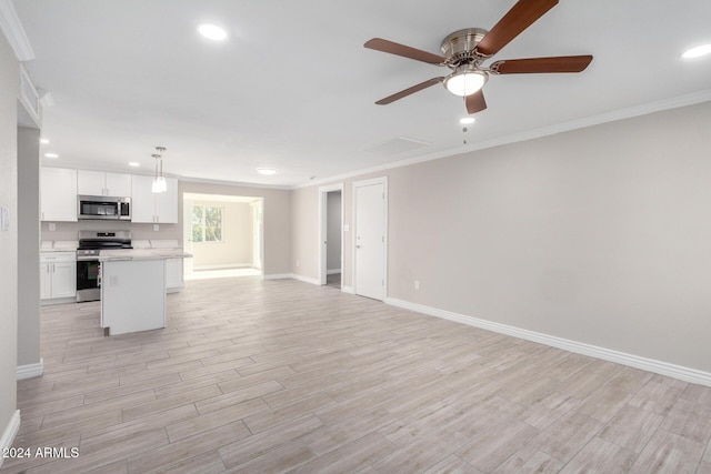 interior space with ceiling fan and ornamental molding