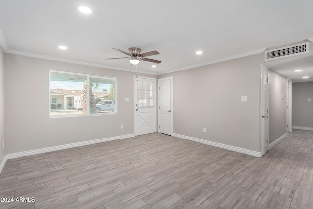 unfurnished room with ceiling fan and ornamental molding