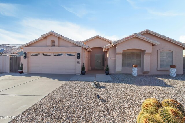 single story home with a garage