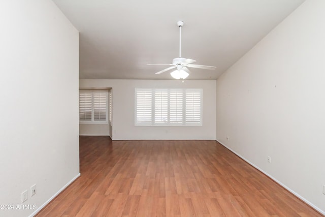 spare room featuring ceiling fan and light wood-type flooring