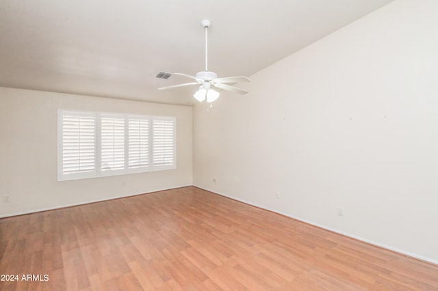 unfurnished room featuring ceiling fan and light wood-type flooring