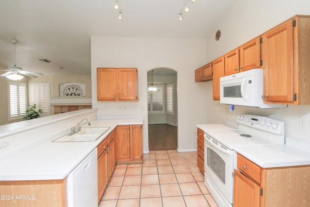 kitchen featuring white appliances, light hardwood / wood-style floors, track lighting, ceiling fan, and sink