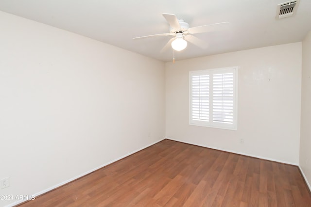 spare room with ceiling fan and hardwood / wood-style floors