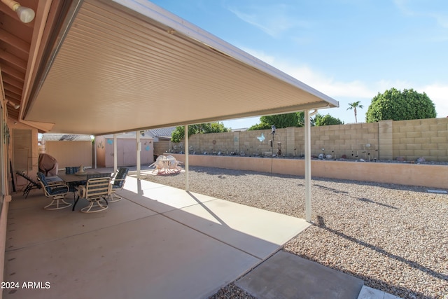 view of patio / terrace featuring a shed