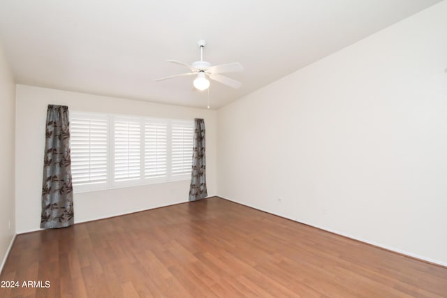 unfurnished room with ceiling fan and hardwood / wood-style flooring