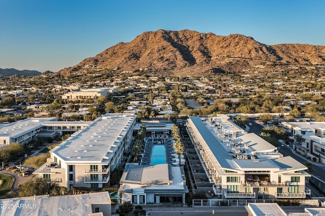 birds eye view of property with a mountain view