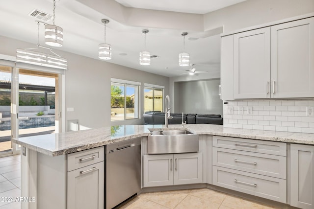 kitchen featuring ceiling fan, dishwasher, hanging light fixtures, and sink