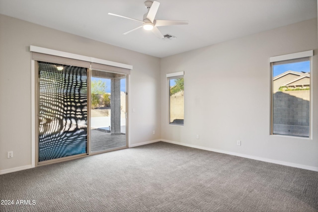 spare room with ceiling fan and carpet floors