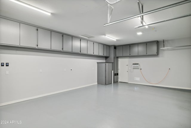 garage with a wall mounted AC