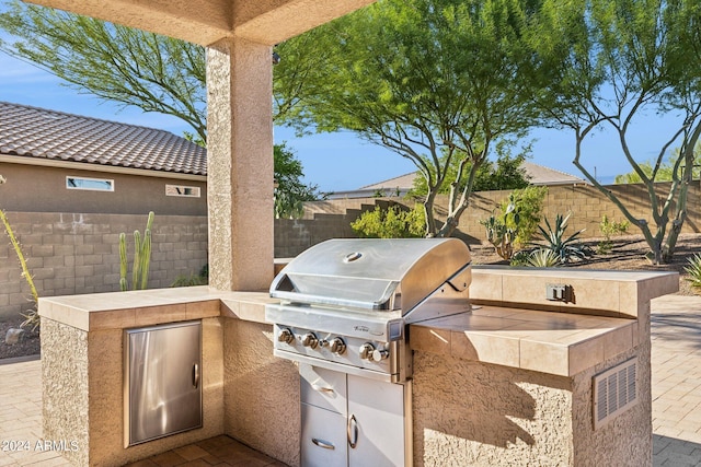 view of patio with a grill and area for grilling