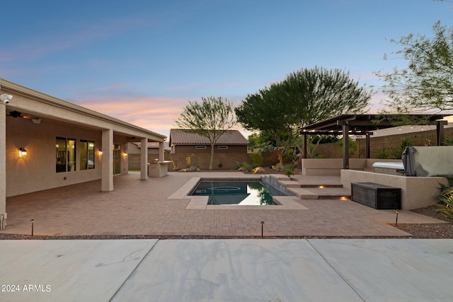 pool at dusk featuring a pergola and a patio