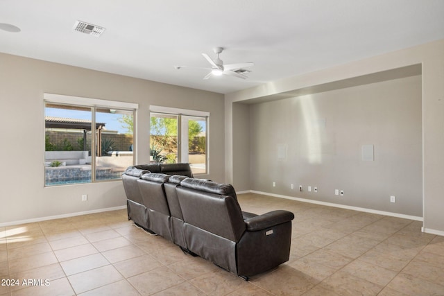 living room with light tile patterned flooring and ceiling fan