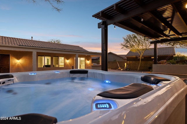 view of pool at dusk