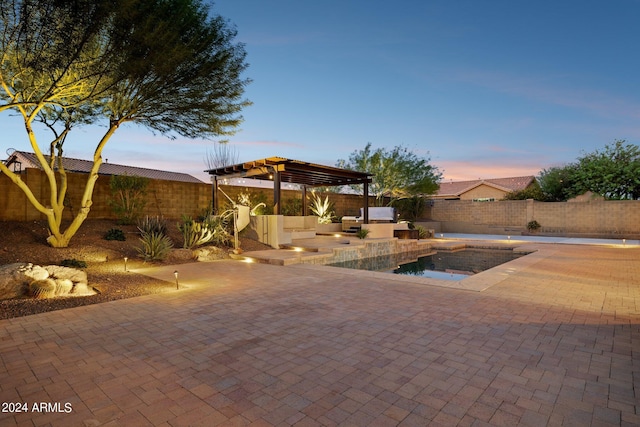 pool at dusk featuring a patio and a pergola