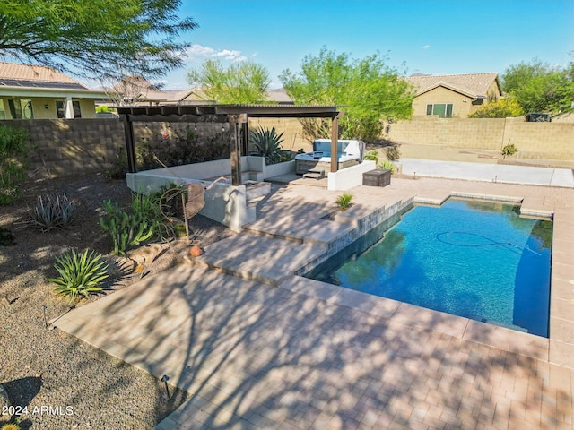 view of swimming pool with outdoor lounge area, a pergola, and a patio