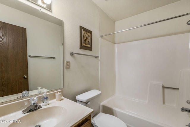 full bathroom featuring vanity, toilet, and  shower combination