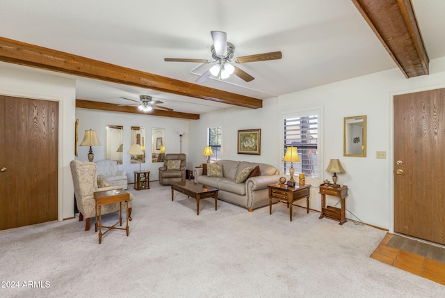 living room featuring light carpet, ceiling fan, and beam ceiling