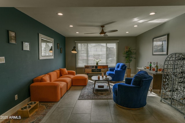 living room featuring a ceiling fan, tile patterned flooring, baseboards, and recessed lighting