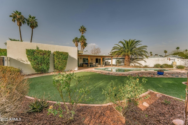 exterior space with fence, a fenced in pool, and a patio