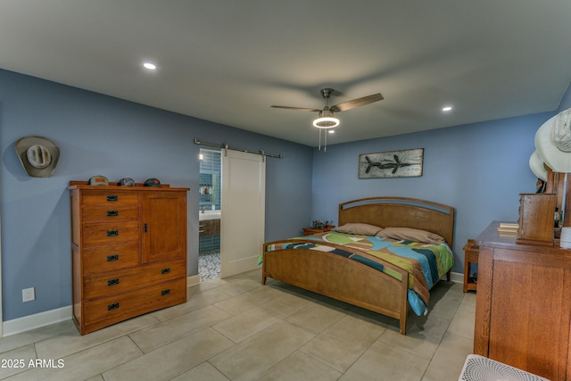bedroom with a barn door, light tile patterned flooring, recessed lighting, a ceiling fan, and baseboards