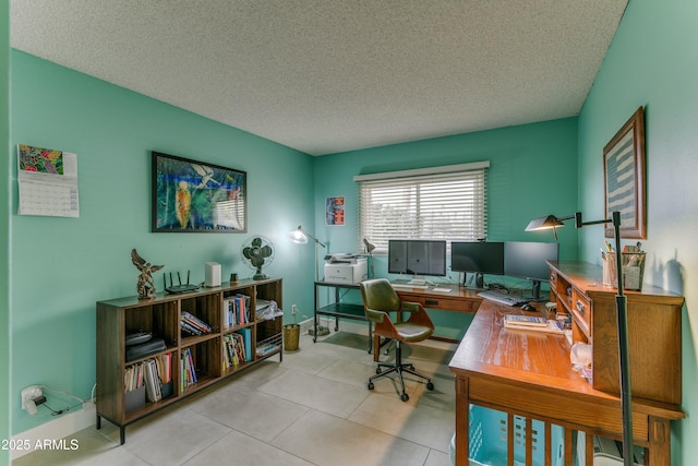 office space with tile patterned flooring and a textured ceiling