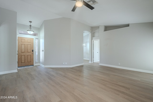 unfurnished living room featuring light hardwood / wood-style flooring and ceiling fan