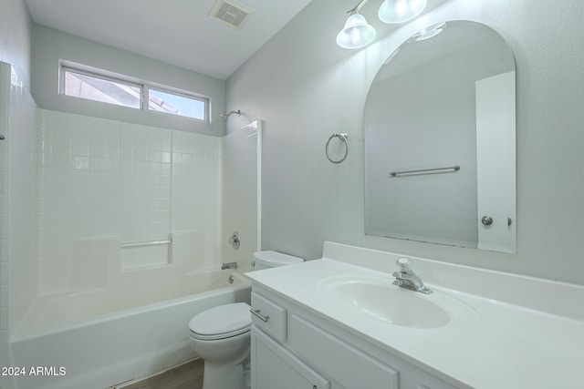 full bathroom with vanity, shower / tub combination, lofted ceiling, hardwood / wood-style flooring, and toilet