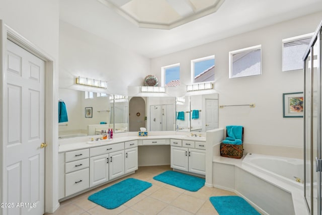 full bath with tile patterned flooring, an enclosed shower, vanity, and a bath