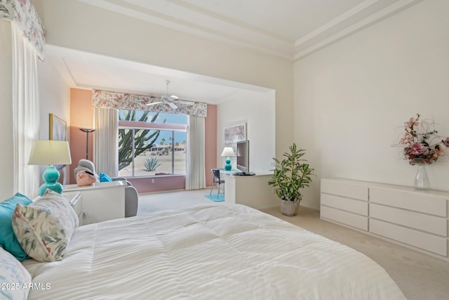 bedroom with ornamental molding and carpet