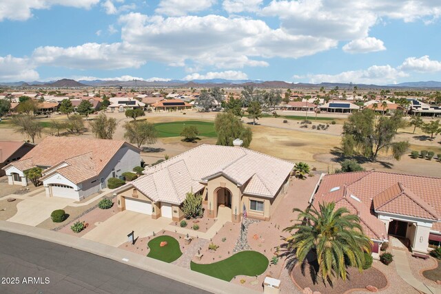 drone / aerial view featuring a mountain view and a residential view