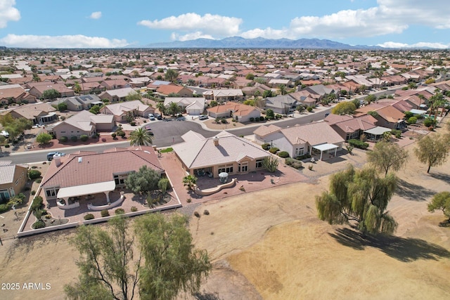 birds eye view of property featuring a mountain view and a residential view