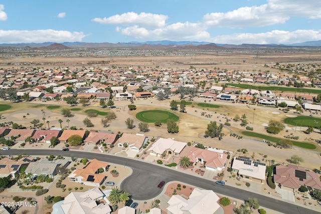 aerial view with a residential view, a mountain view, and golf course view