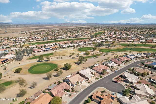 aerial view with a residential view, a mountain view, and golf course view