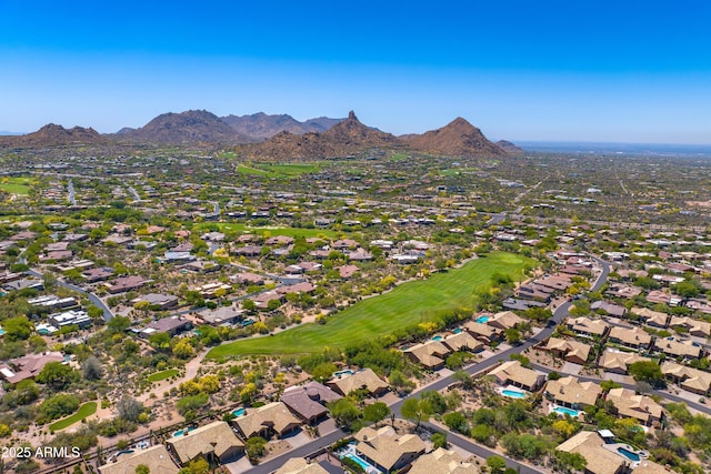 9534 E Monument Dr, Scottsdale, AZ 85262 - aerial view of property and surrounding area with a mountainous background, nearby suburban area, and a golf course