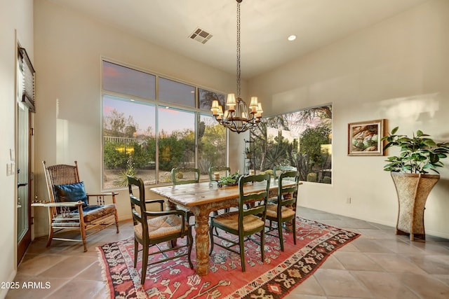 9534 E Monument Dr, Scottsdale, AZ 85262 - dining area featuring a chandelier, a high ceiling, and tile patterned floors