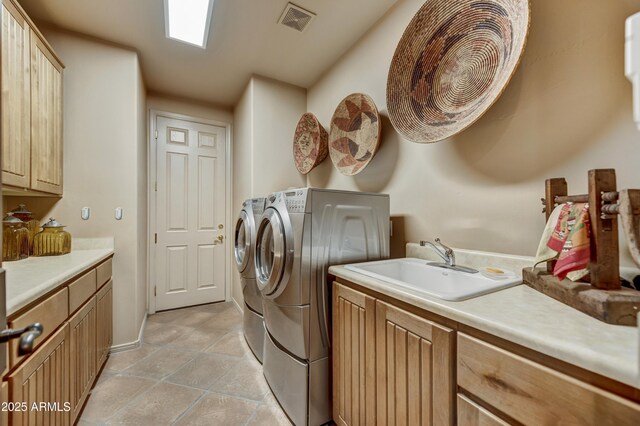 9534 E Monument Dr, Scottsdale, AZ 85262 - washroom with cabinet space, independent washer and dryer, and light tile patterned floors