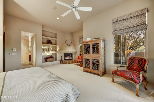 9534 E Monument Dr, Scottsdale, AZ 85262 - carpeted bedroom featuring a glass covered fireplace and recessed lighting