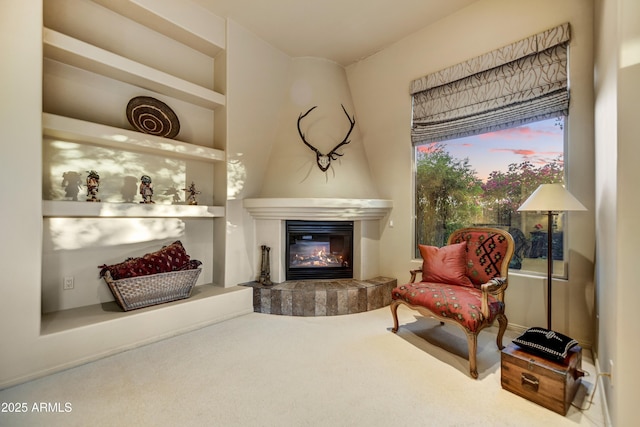9534 E Monument Dr, Scottsdale, AZ 85262 - sitting room with a tiled fireplace and carpet