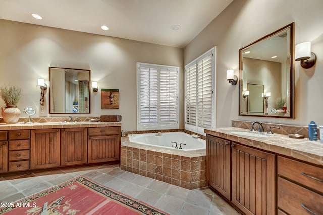 9534 E Monument Dr, Scottsdale, AZ 85262 - bathroom featuring a garden tub, two vanities, tile patterned flooring, and recessed lighting