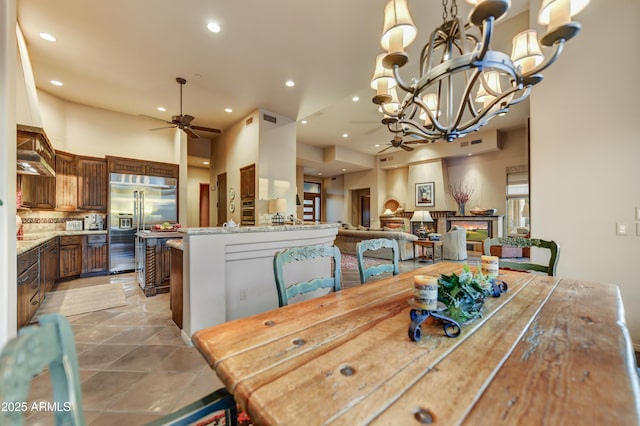 9534 E Monument Dr, Scottsdale, AZ 85262 - dining area with a ceiling fan, a chandelier, and recessed lighting