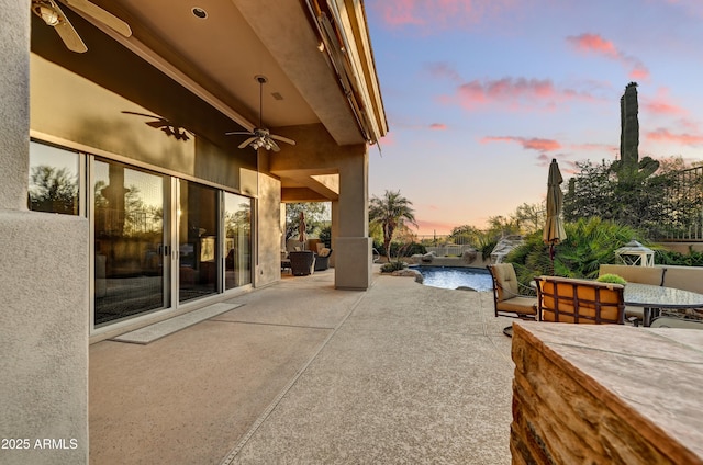 9534 E Monument Dr, Scottsdale, AZ 85262 - view of patio / terrace with a ceiling fan, outdoor dining area, and an outdoor pool