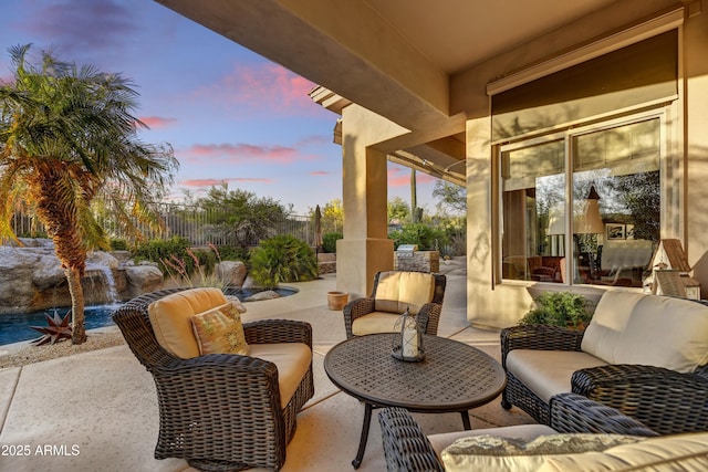 9534 E Monument Dr, Scottsdale, AZ 85262 - patio terrace at dusk featuring an outdoor hangout area and a patio