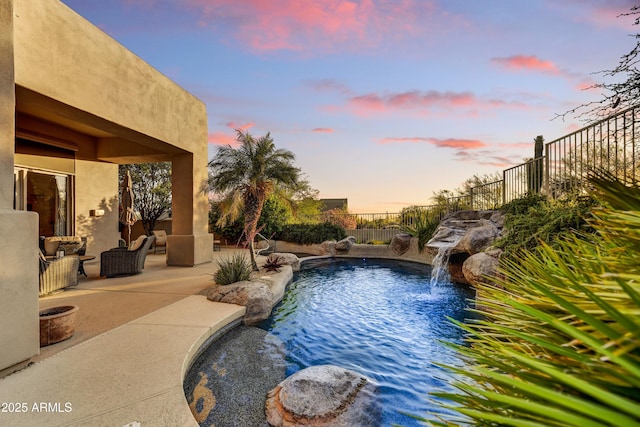 9534 E Monument Dr, Scottsdale, AZ 85262 - pool at dusk with a patio area