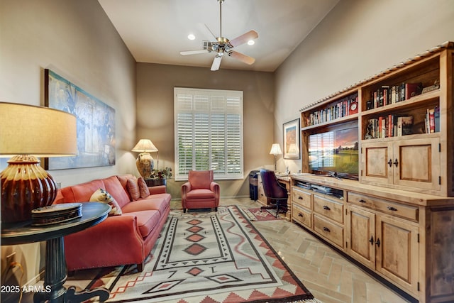 9534 E Monument Dr, Scottsdale, AZ 85262 - living area featuring a ceiling fan, recessed lighting, a desk, brick flooring, and baseboards