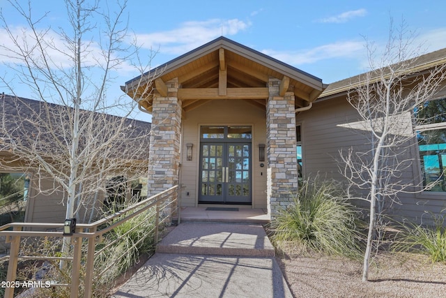 view of exterior entry featuring french doors