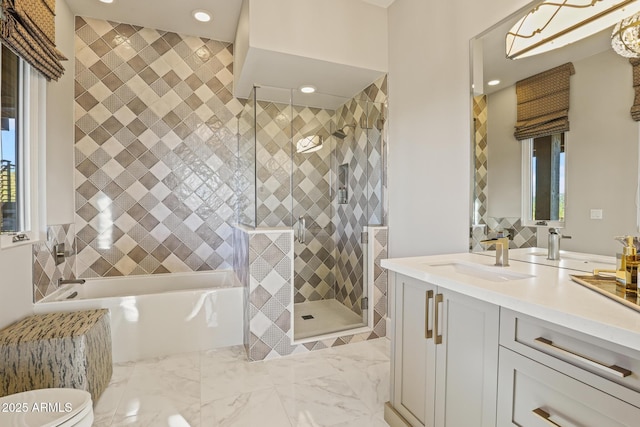 full bath featuring toilet, vanity, marble finish floor, a bath, and a stall shower